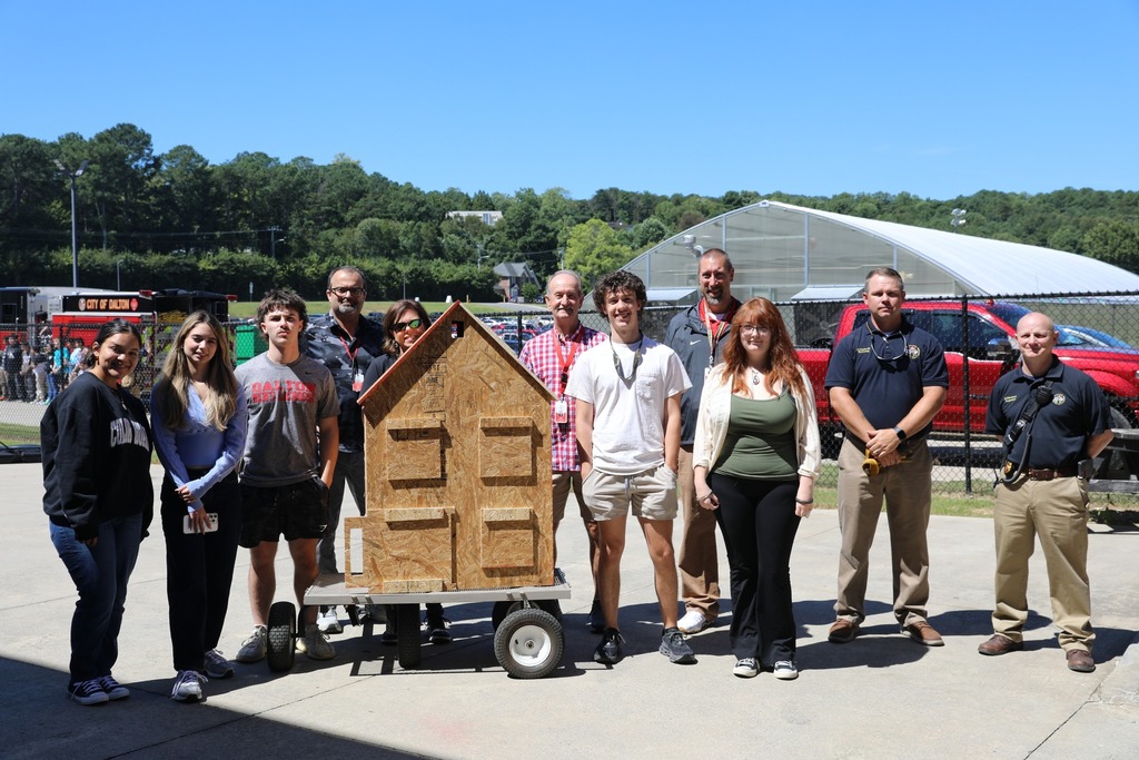 Amy Gleaton’s Forensics class at Dalton High School received funding through the Dalton Education Foundation’s Grants for Instruction program to purchase materials for engineering students to build spec houses and stick houses. Once completed, these student-built structures were used in partnership with the Dalton Fire Department Arson Unit to study fire behavior and learn important fire safety skills.