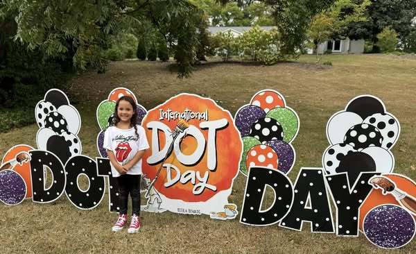 student at Dot Day display