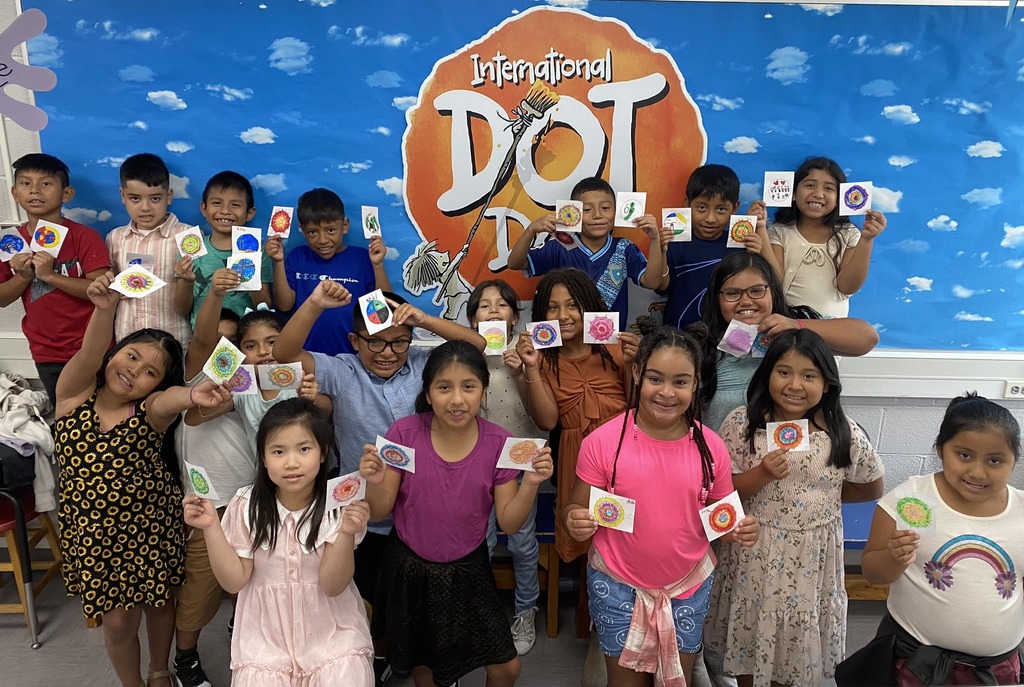Students showing Dot Day work