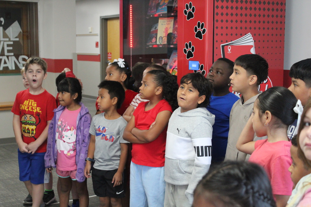 Students placing dots on wall 