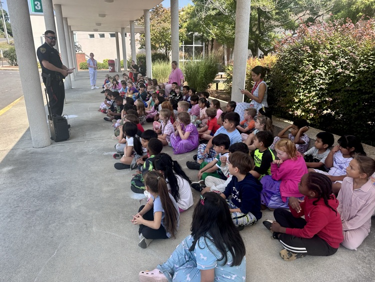 students listening to Officer Warren 