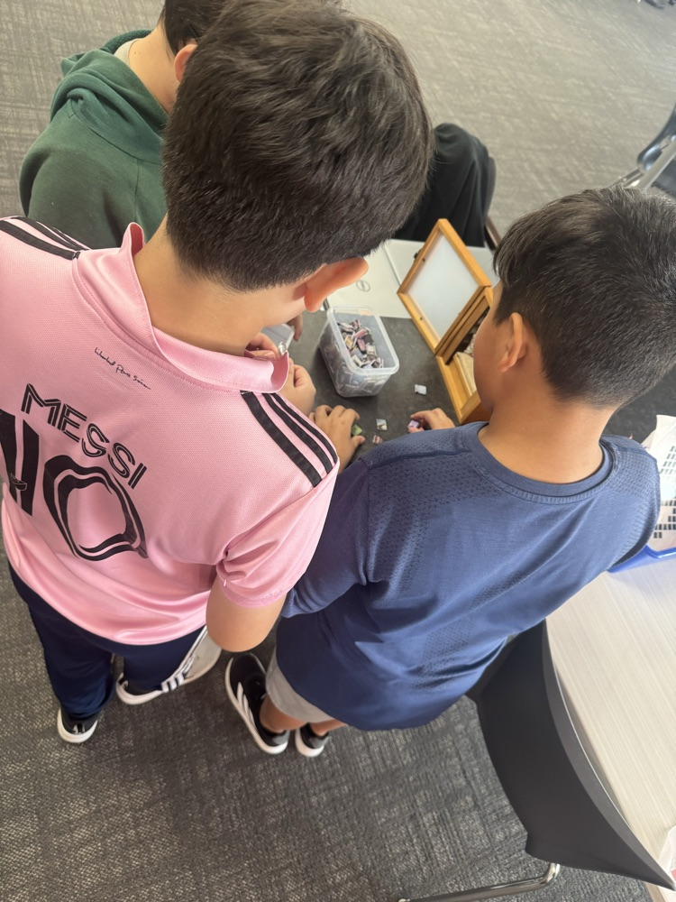 photo of boys at tiny library 