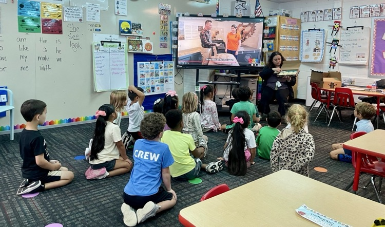 Students listening to Ms. Diaz talking about fossils 