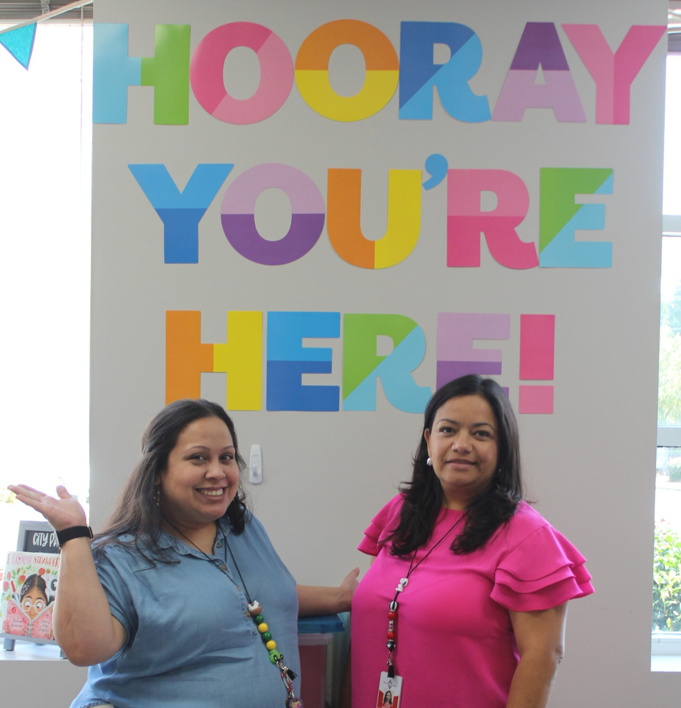 Photo of two smiling staff members
