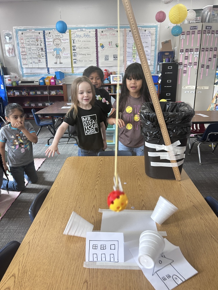 kindergartners working on science experiment 