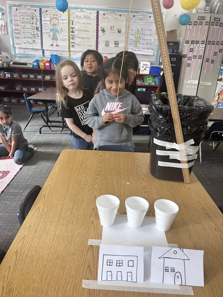 kindergartners working on science experiment 