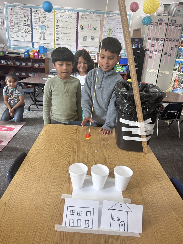 kindergartners working on science experiment 