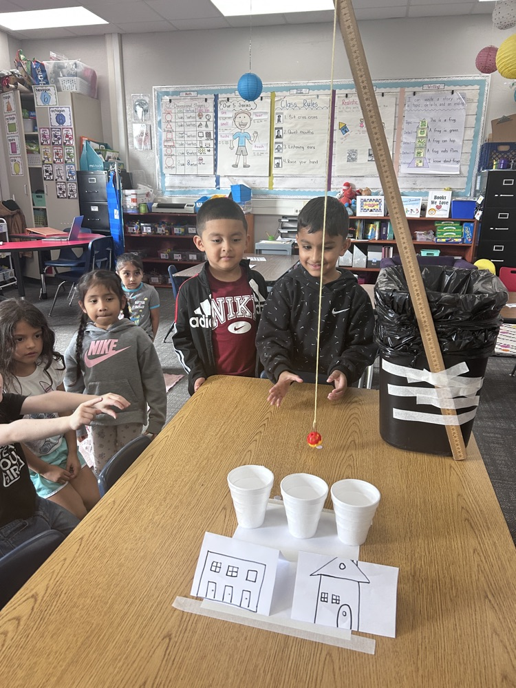 kindergartners working on science experiment 