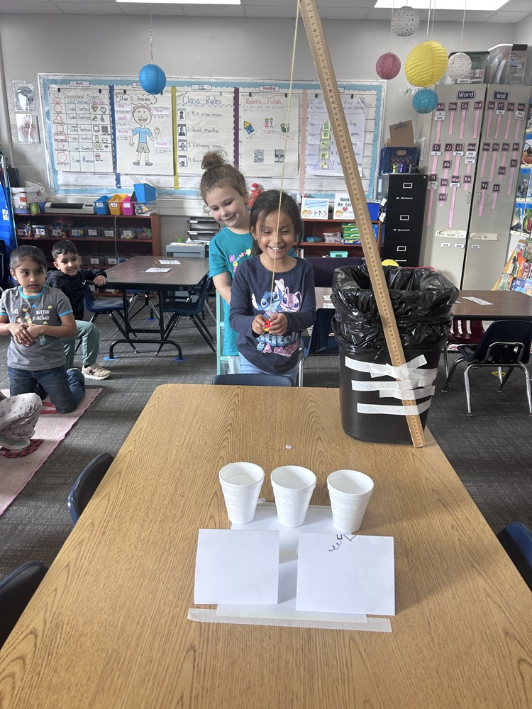 kindergartners working on science experiment 