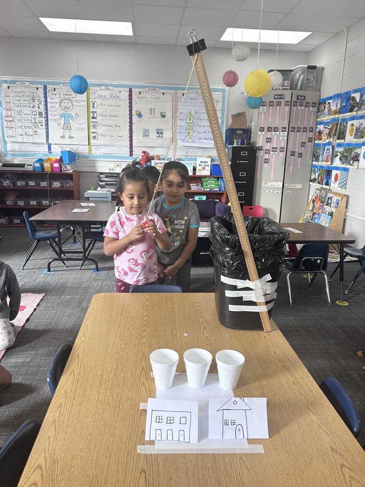 kindergartners working on science experiment 
