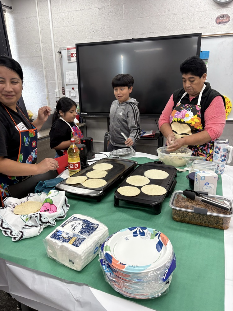 students helping make tortillas