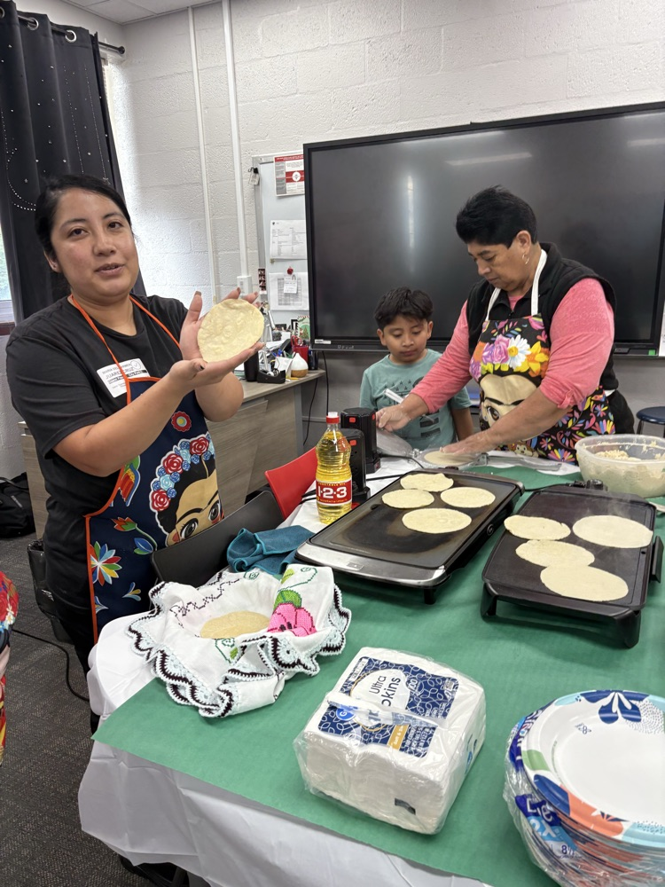 students helping make tortillas