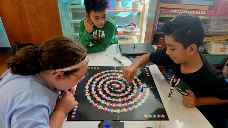Students playing a board game