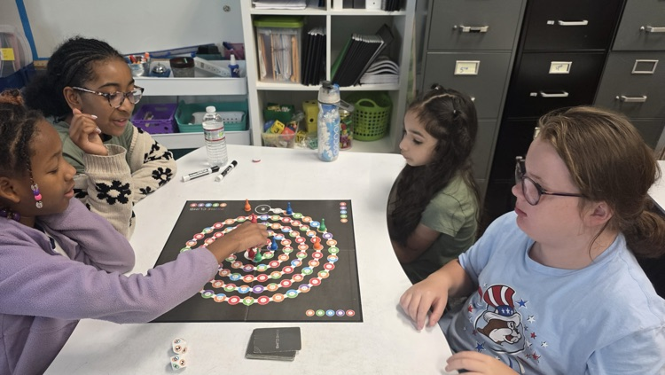 Students playing a board game