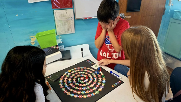 Students playing the board game 