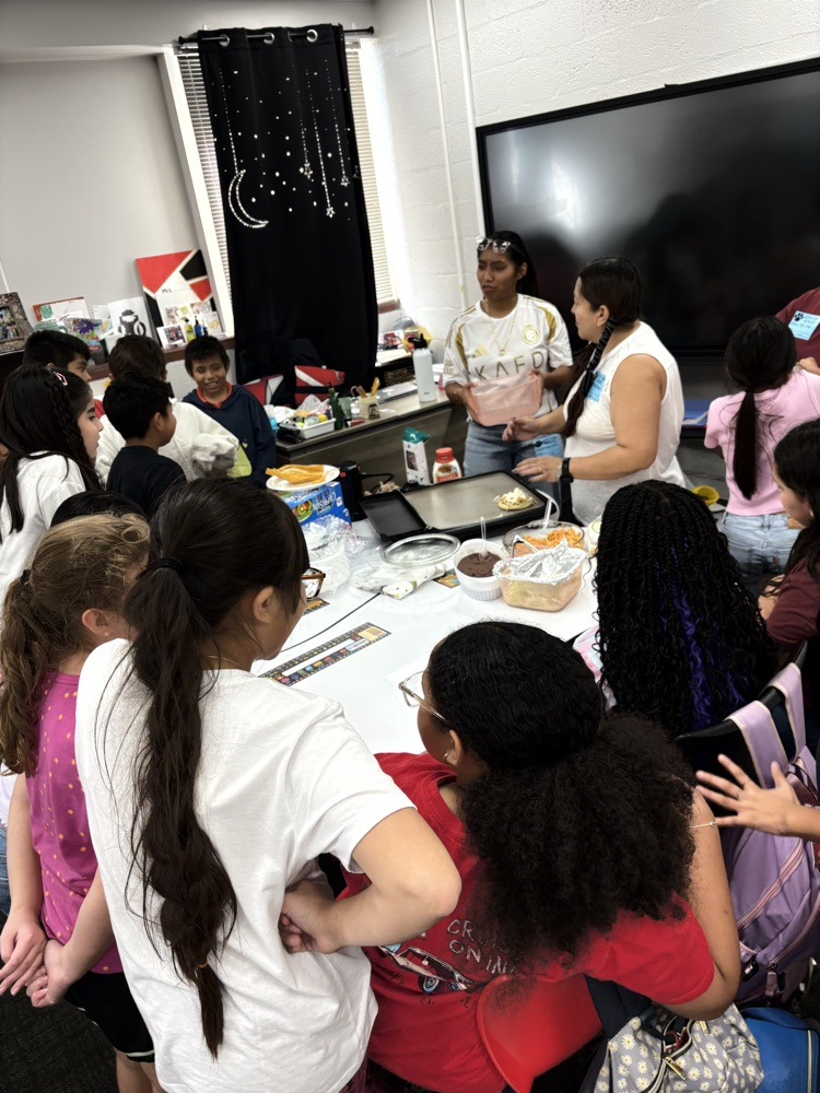 students making dish in classroom 