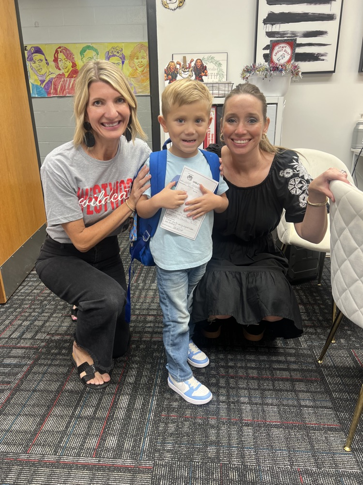 A picture of Julian with Mrs. Smith & Mrs. Ridley 