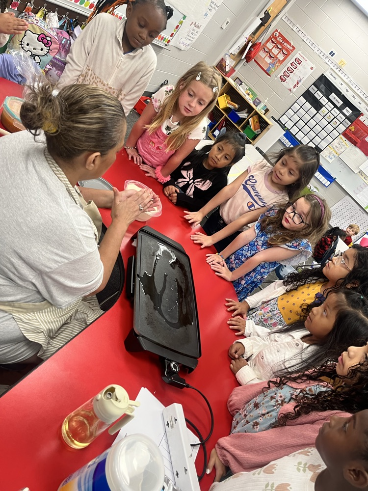 students in classroom at table 
