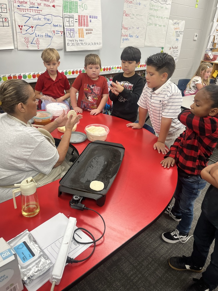 students in classroom at table 