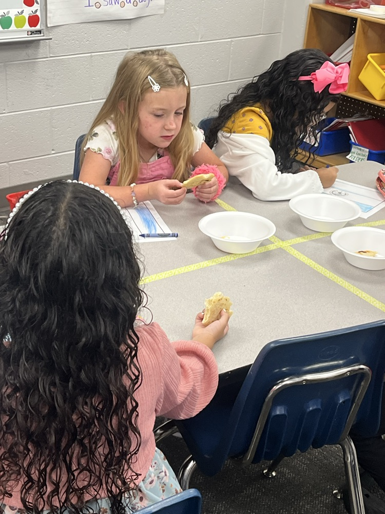 students in classroom at table 