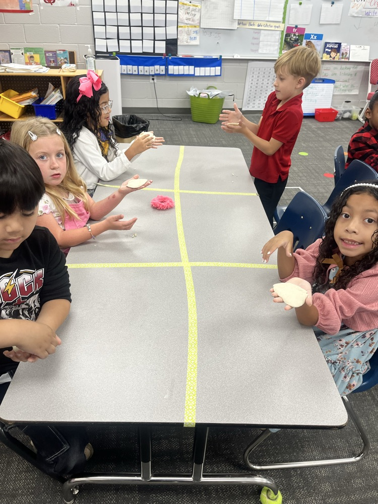 students in classroom at table 