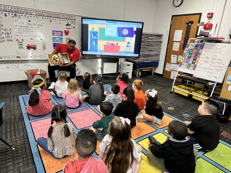 Deputy Superintendent Nick Sun reading to a PreK class