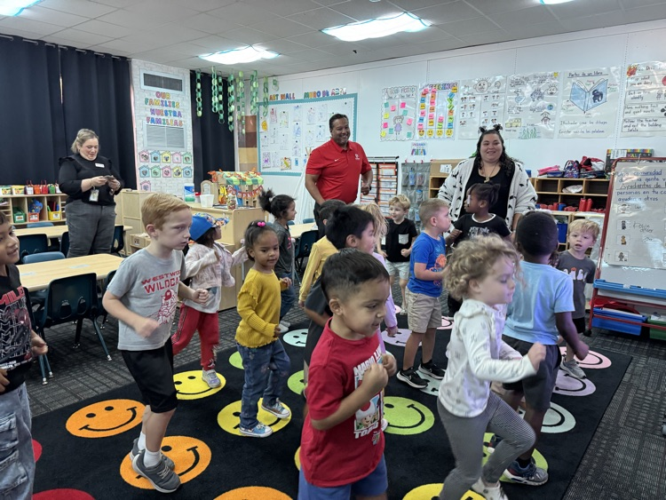 Deputy Superintendent exercising with PreK students