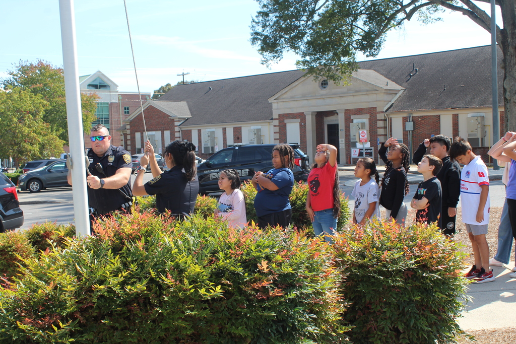 students folding the American flag