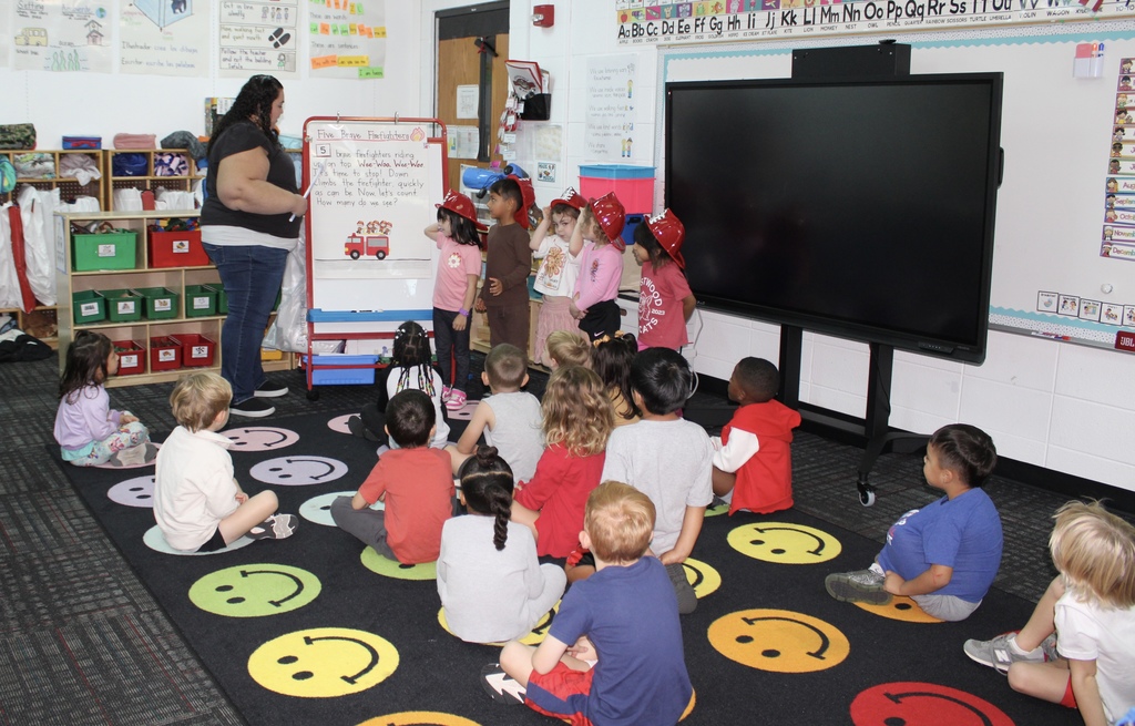  In Maribel Landeros’ class at Westwood School, students are learning about community helpers. They read and acted out the story “Five Brave Firefighters.” During the activity, students took on the roles of the firefighters and practiced their subtraction skills in a fun and engaging way.