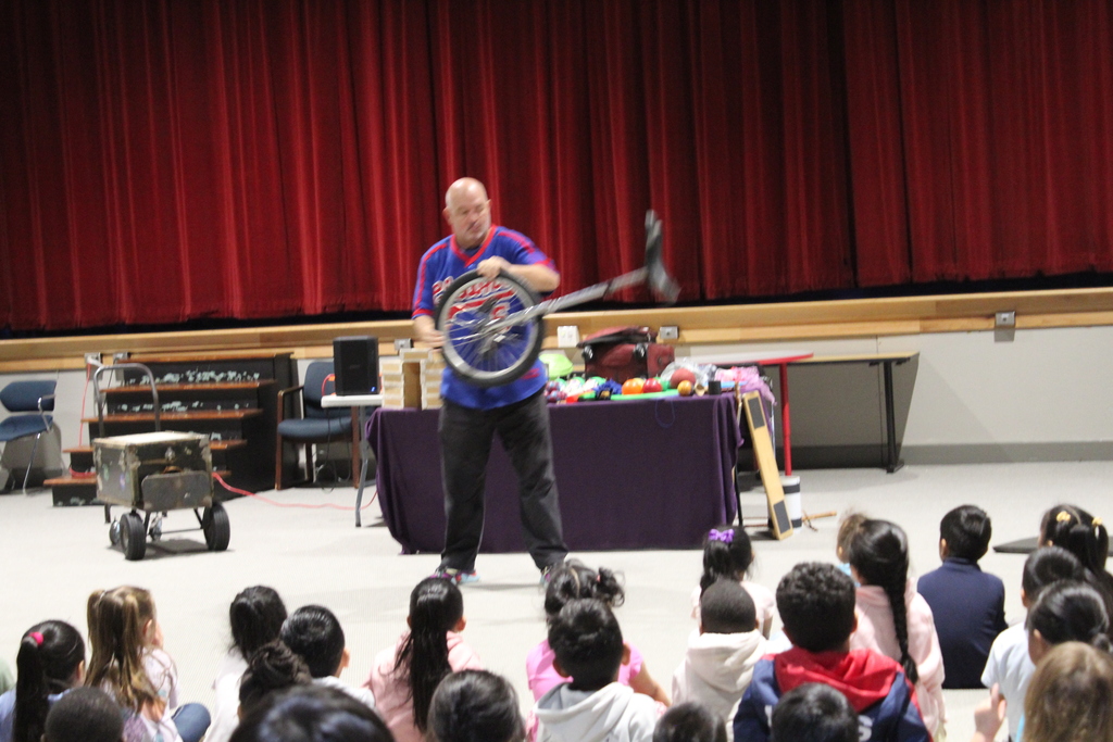 performer in school assembly 