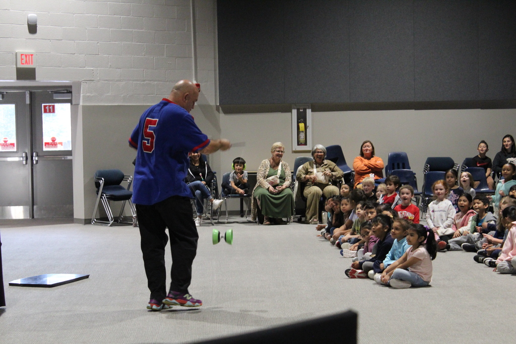performer in school assembly 