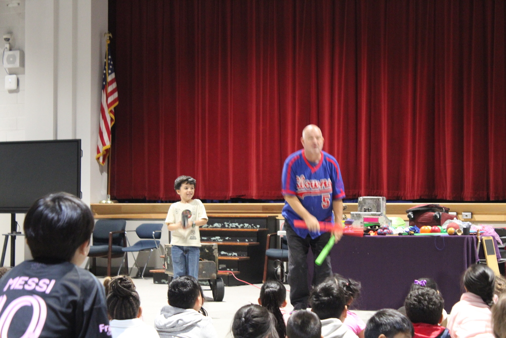 performer in school assembly 