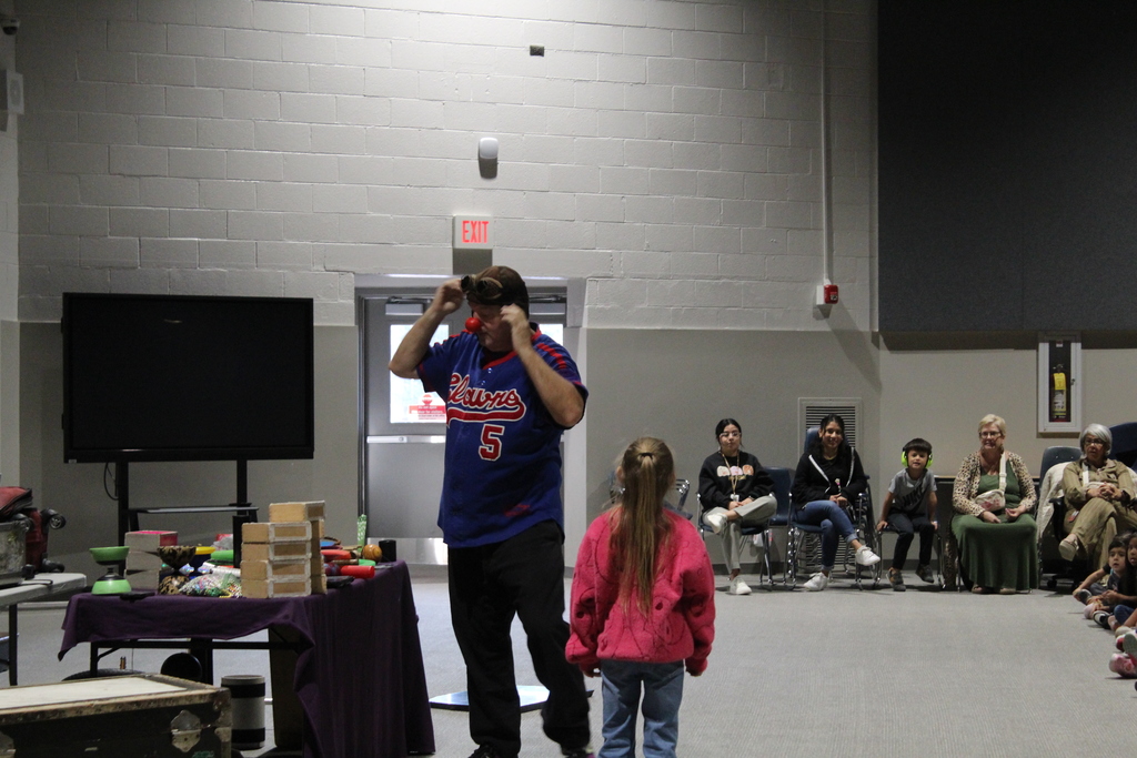 performer in school assembly 
