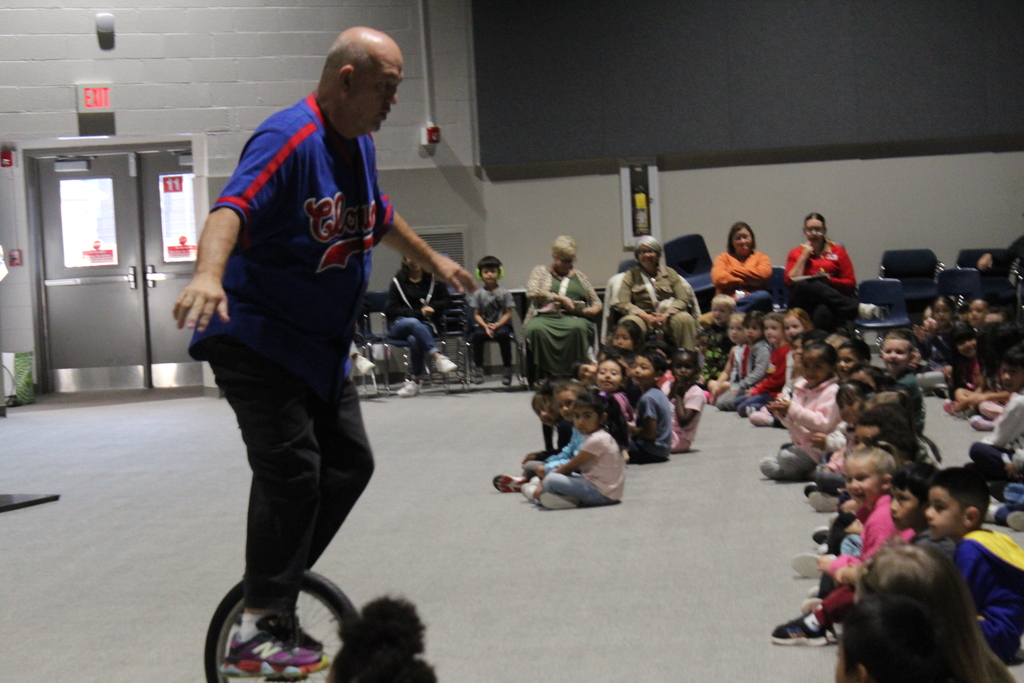 performer in school assembly 
