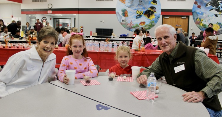 Two students with their grandparents 