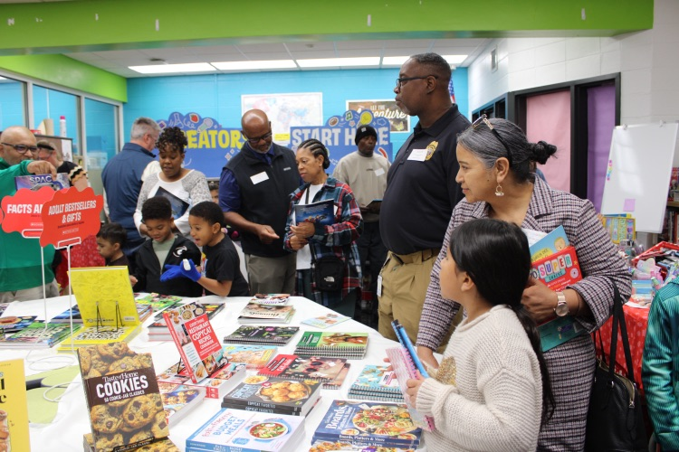 A group of grandparents shopping with their kids at the Book Fair