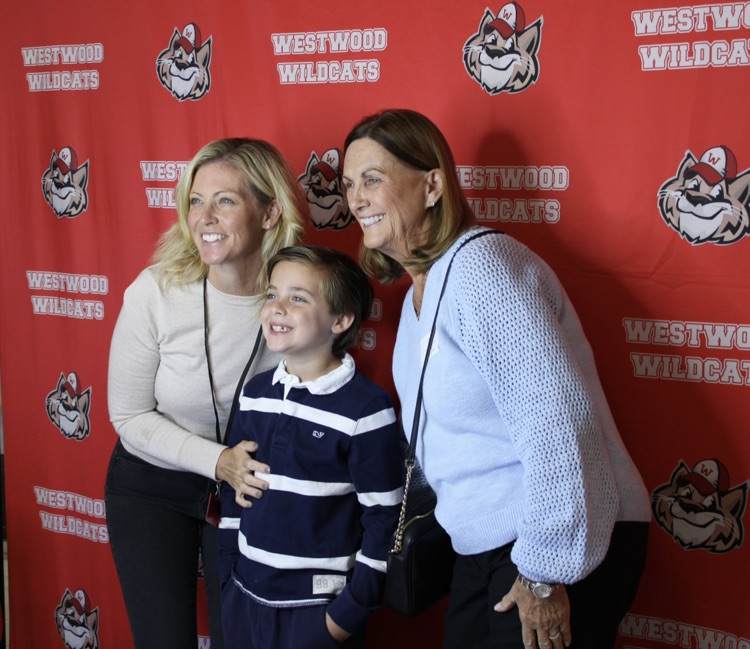 A family taking a picture at the Photo Booth 