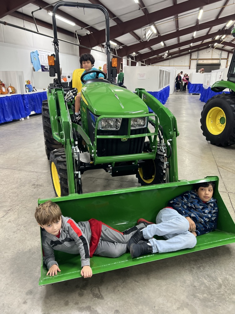 Students in a tractor at the fair 