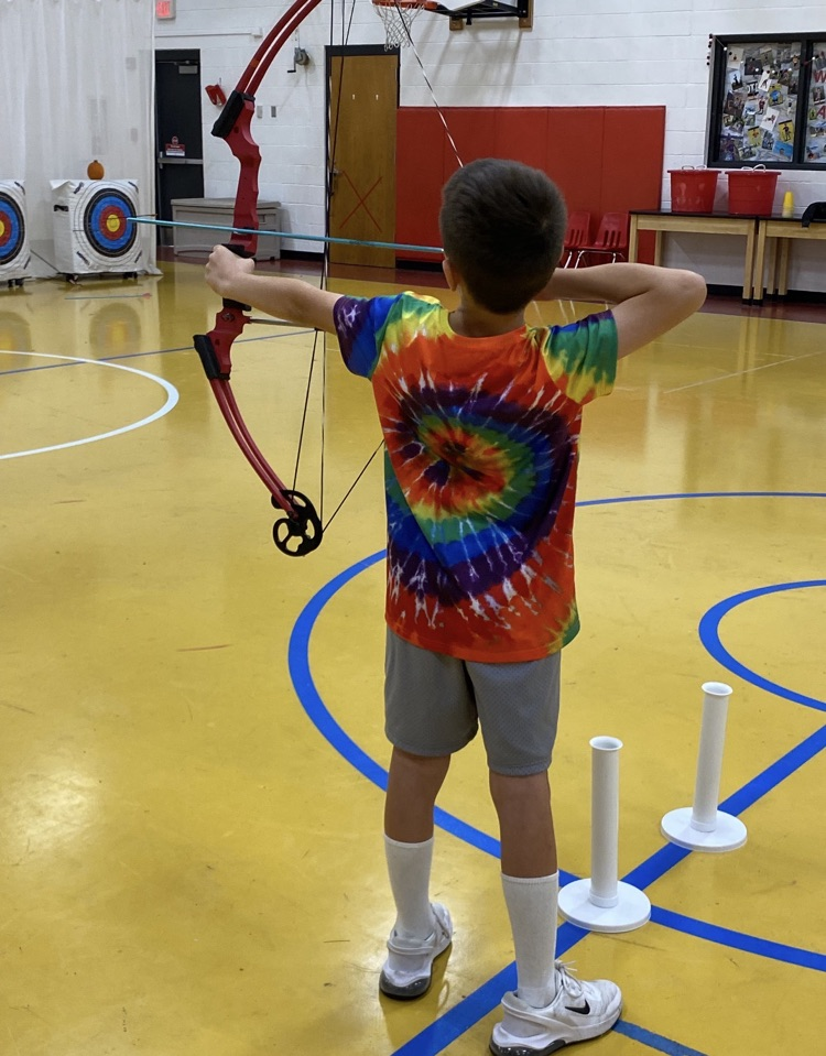 A student ready to release the arrow 