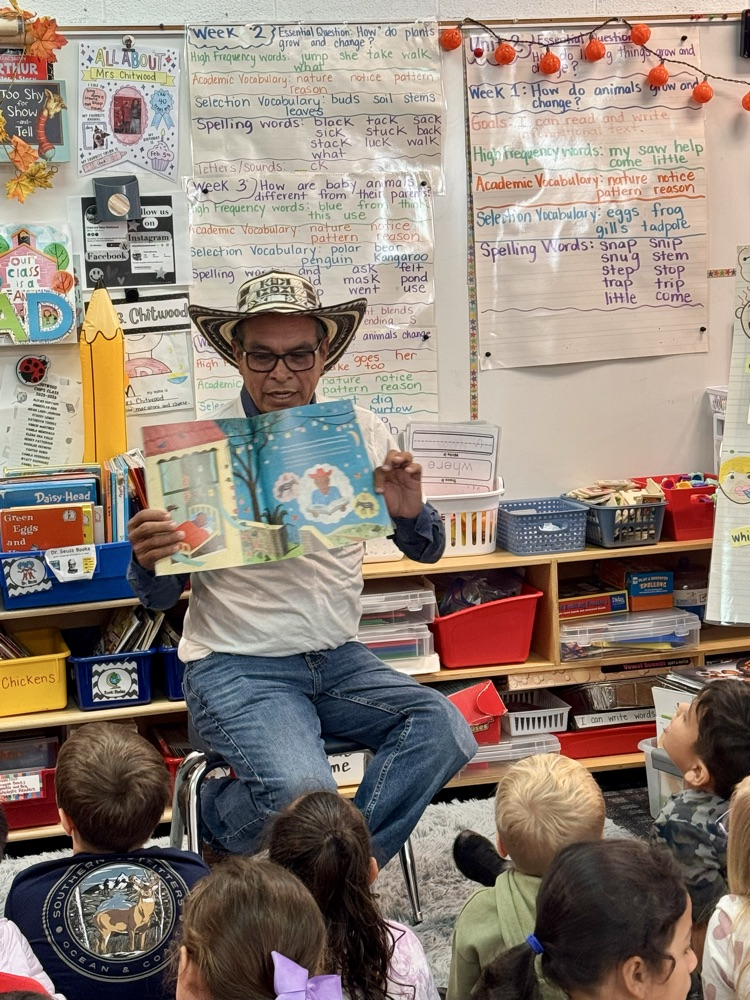 Mr. Soriano showing the book to students
