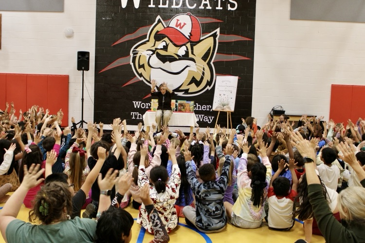 Students interacting with Carmen Deedy