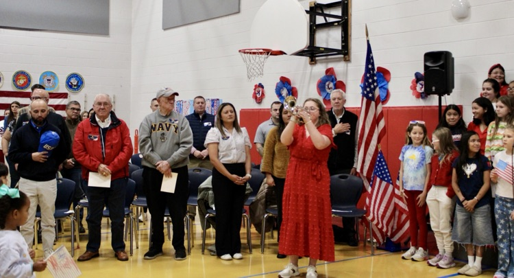 Mrs. Cantrell performing “taps” 