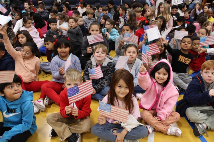 Students holding flags 