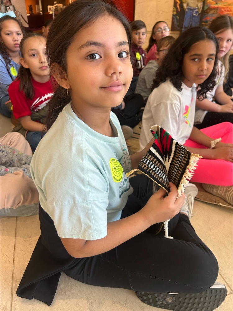 Student holding a piece of fabric  