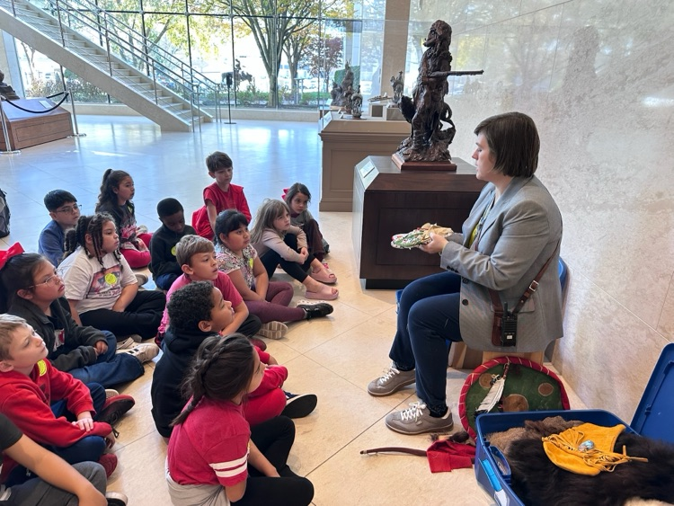 Students listening to the tour guide presentation 