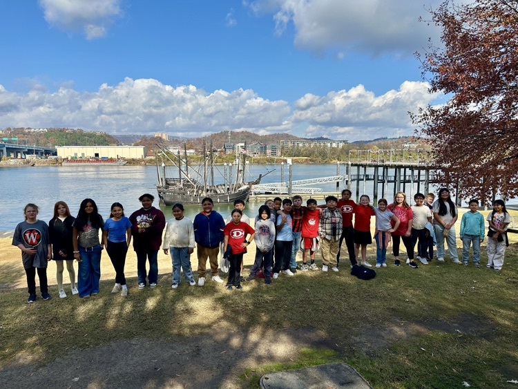 A picture of Mrs. Lewis class with the ships on the background 