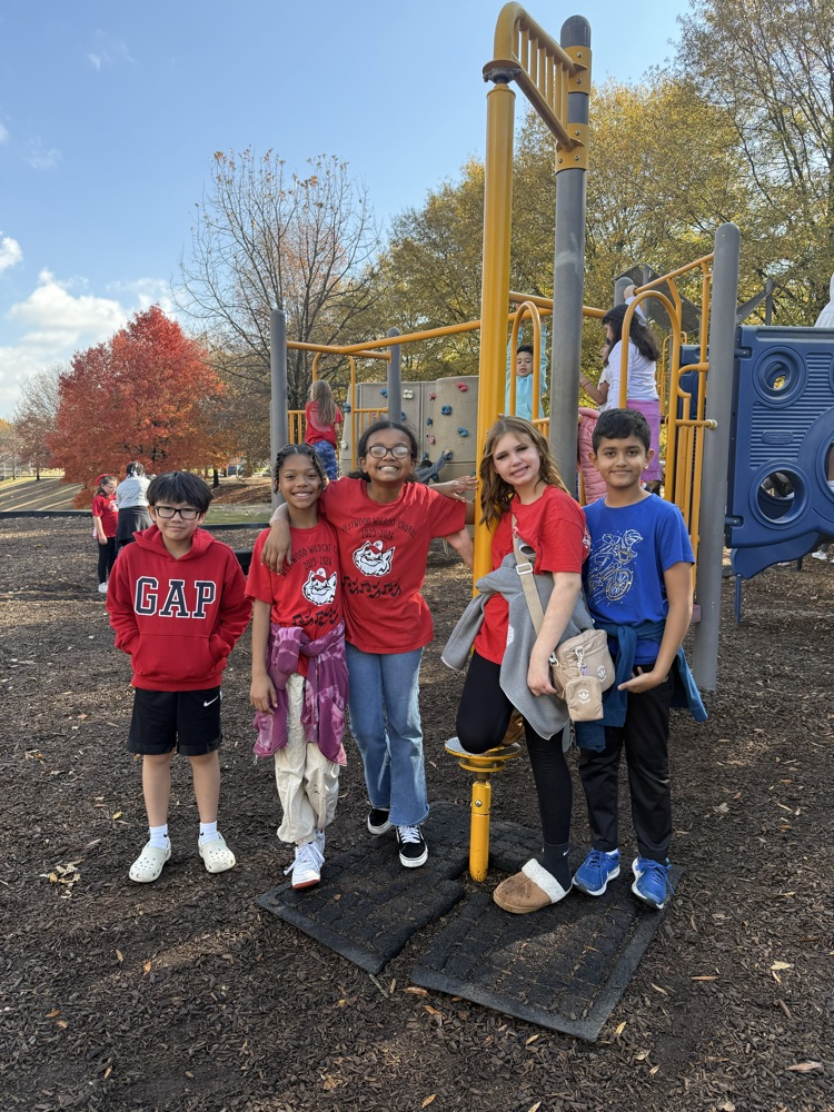 A group of kids playing on the playground 