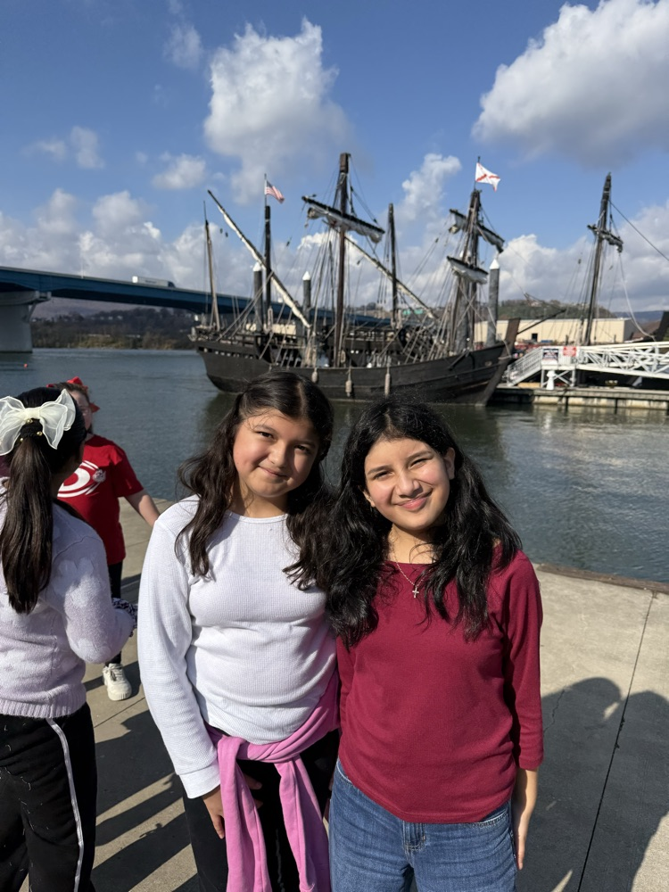 Two students standing in front of the ship 