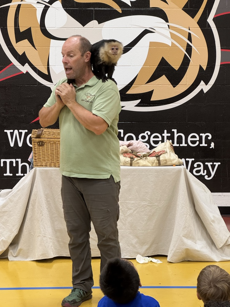 The presenter with a monkey on his shoulders 