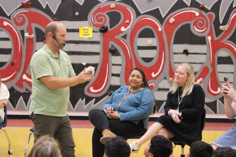 The presenter holding a porcupine 
